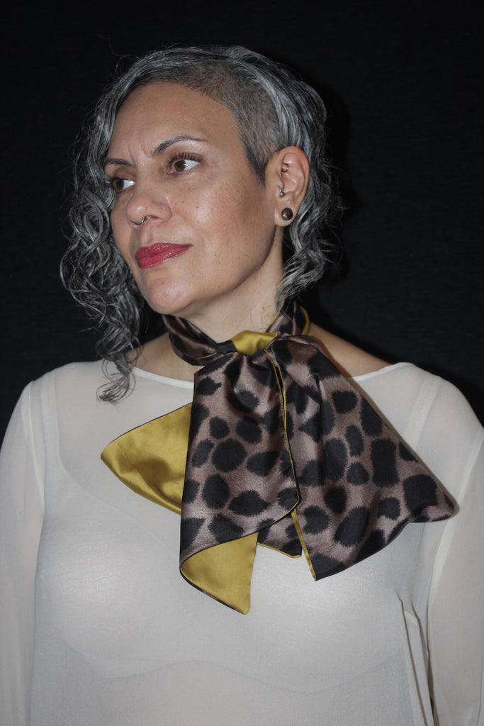 Women wears silk black and tan Animal print and cotton mustard scarf tied in loose bow, Citizen Women