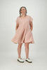 Woman wearing rose coloured linen square neck dress with side pockets Citizen Women