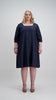 Woman wears navy coloured flared square neck dress Citizen Women