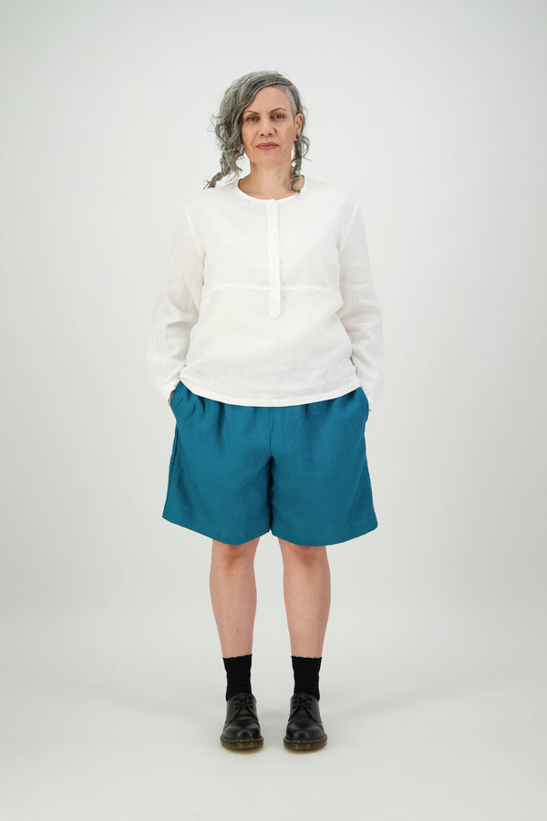 Woman wears white 100% linen shirt with hem just below hips Citizen Women 