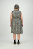 Women wearing knee length dress in black and cream animal print fabric with lustre Citizen Women 
