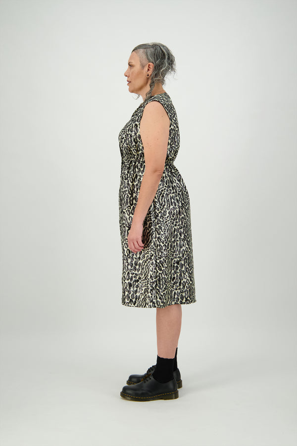 Woman wearing sleeveless, 9 button dress in silk, linen and lurex animal print Citizen Women 
