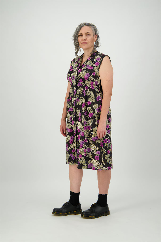 Three quarter view woman wears below the knee dress with matching covered buttons Citizen Women