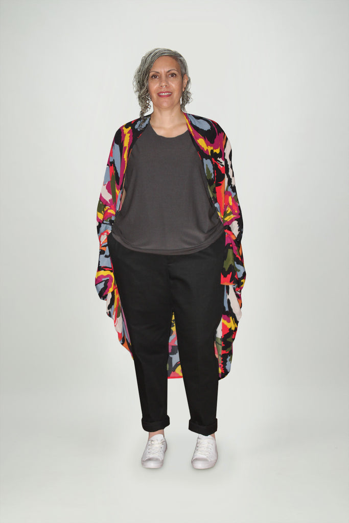 Woman wears long multi coloured  abstract print rayon shrug Citizen Women